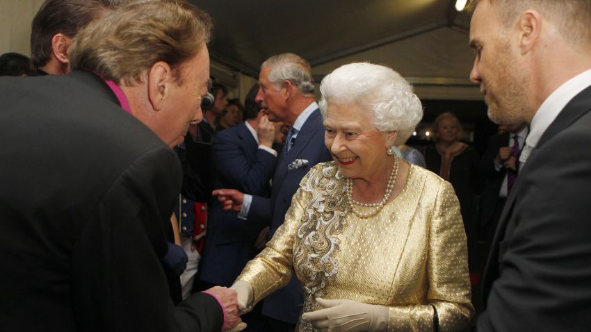 LONDON, ENGLAND - JUNE 04:  Queen Elizabeth II is introduced to Sir Andrew Lloyd Webber (L) by Gary Barlow  (R) backstage after the Diamond Jubilee, Buckingham Palace Concert June 04, 2012 in London, England. For only the second time in its history the UK celebrates the Diamond Jubilee of a monarch. Her Majesty Queen Elizabeth II celebrates the 60th anniversary of her ascension to the throne. Thousands of well-wishers from around the world have flocked to London to witness the spectacle of the weekend's celebrations.  (Photo by Dave Thompson - WPA Pool/Getty Images)