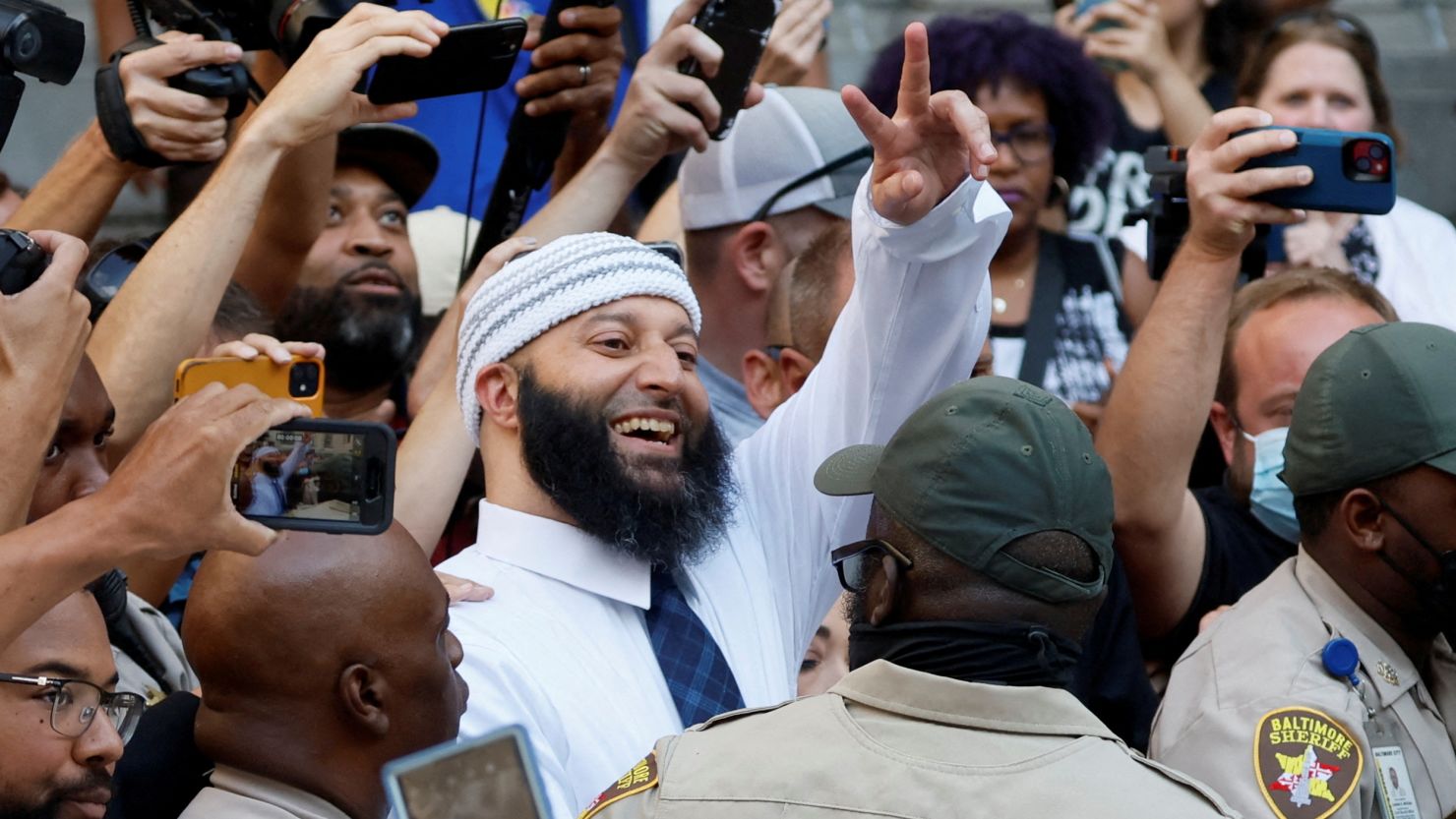 Adnan Syed, whose case was chronicled in the hit podcast "Serial," smiles and waves as he leaves the courthouse after a judge overturned Syed's 2000 murder conviction.