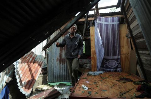 A man in El Seibo, Dominican Republic, looks at his house in the aftermath of Hurricane Fiona on Tuesday, September 20.