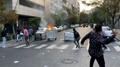 A bin burning in the middle of an intersection during a protest in Tehran, Iran, on September 20.