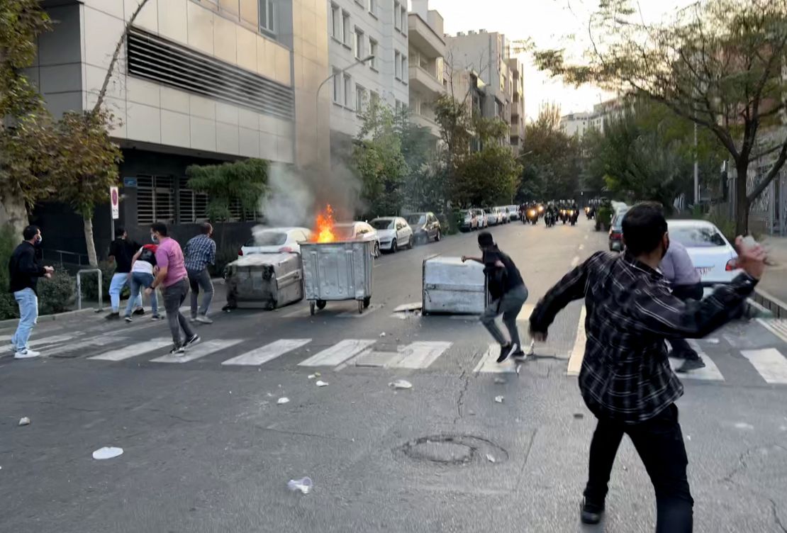 A bin burning in the middle of an intersection during a protest in Tehran, Iran, on September 20.