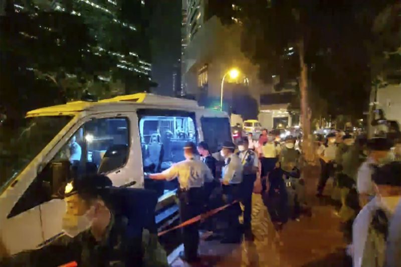 Hong Kong police arrest man who played harmonica at Queen's vigil on suspicion of sedition