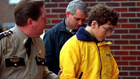 Michael Carneal is escorted out of the McCracken County Courthouse after his arraignment in Paducah on January 15, 1998.