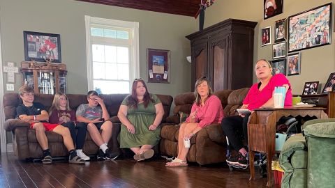 Missy Jenkins Smith, right, talks to reporters at her home in Kirksey, Kentucky, Tuesday while waiting for a decision from a parole board panel.