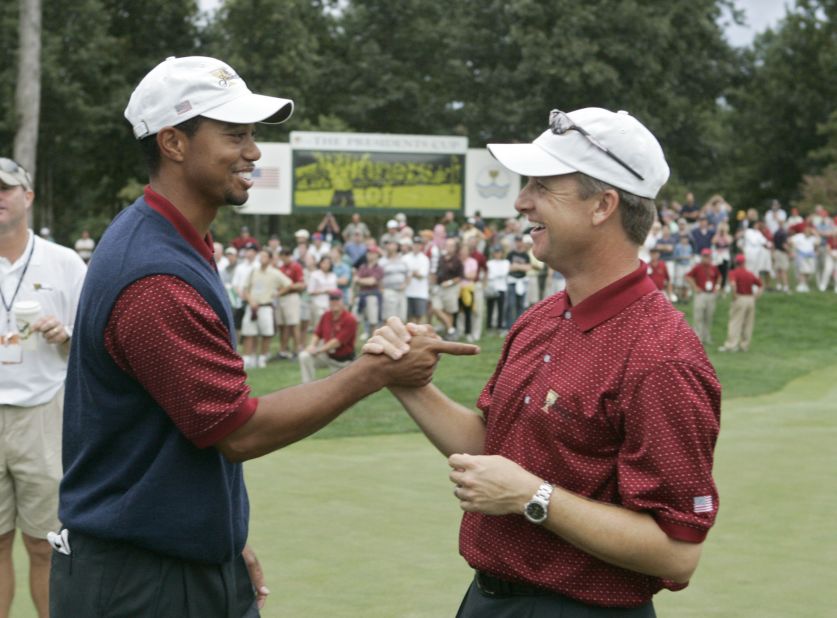 Woods (L) and David Toms (R) celebrate another US triumph following a 18.5 - 15.5 victory at Robert Trent Jones Golf Club in 2005. Chris DiMarco fittingly clinched victory for the Americans having secured a team-best 4.5 points.