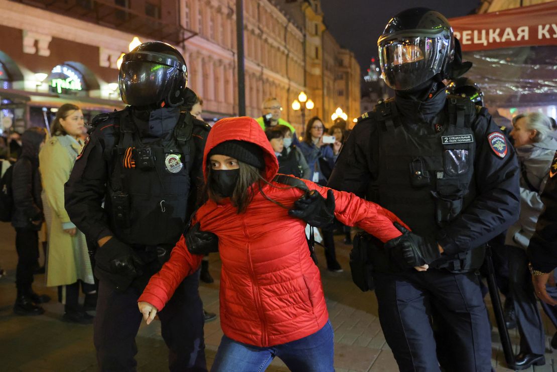 Russian police officers detain a person during an unsanctioned rally, after opposition activists called for street protests against the mobilisation of reservists ordered by President Vladimir Putin, in Moscow, Russia September 21, 2022.