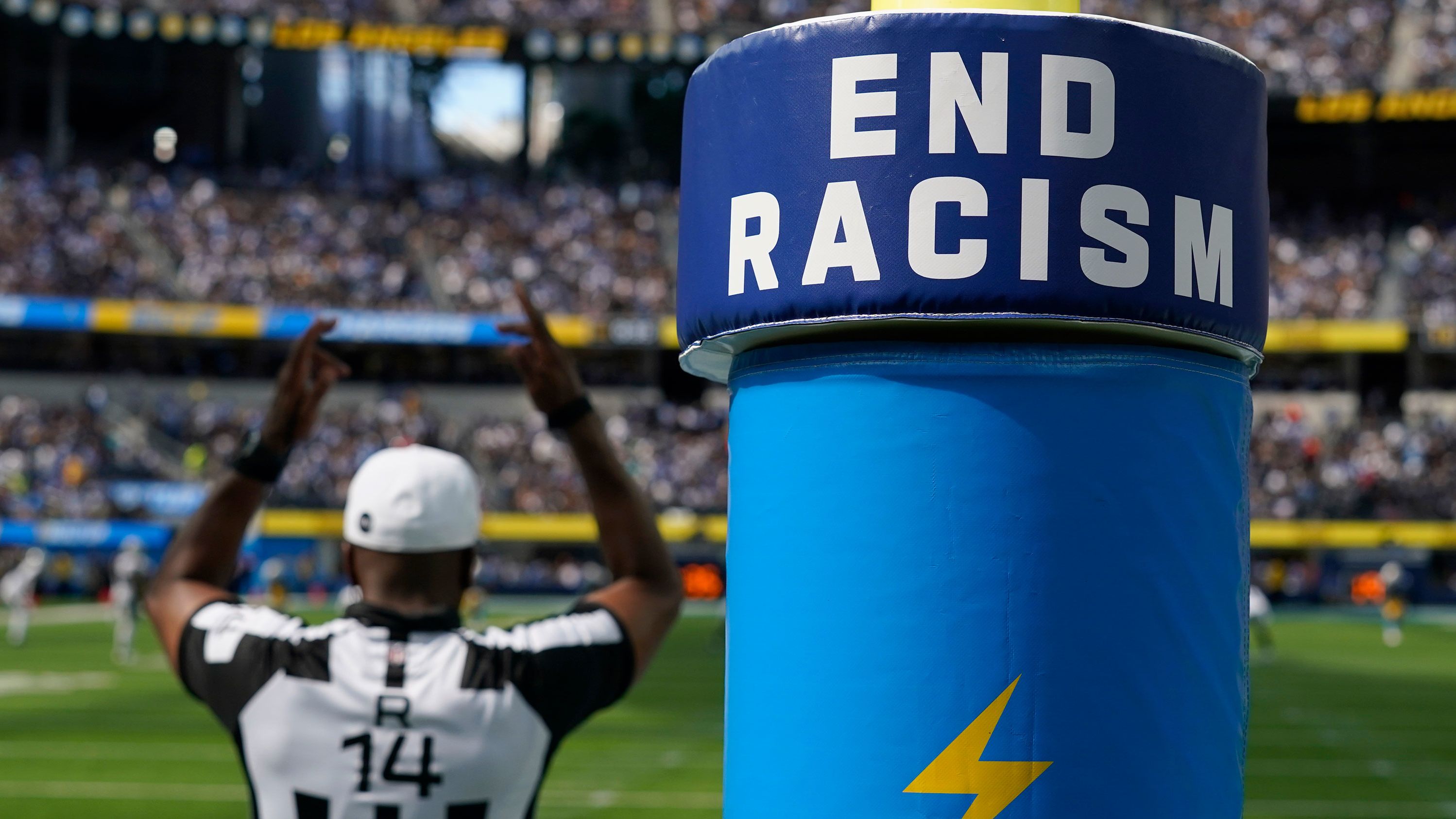 An "End Racism" sign is shown on a goal post during an NFL game on September 11, 2022.