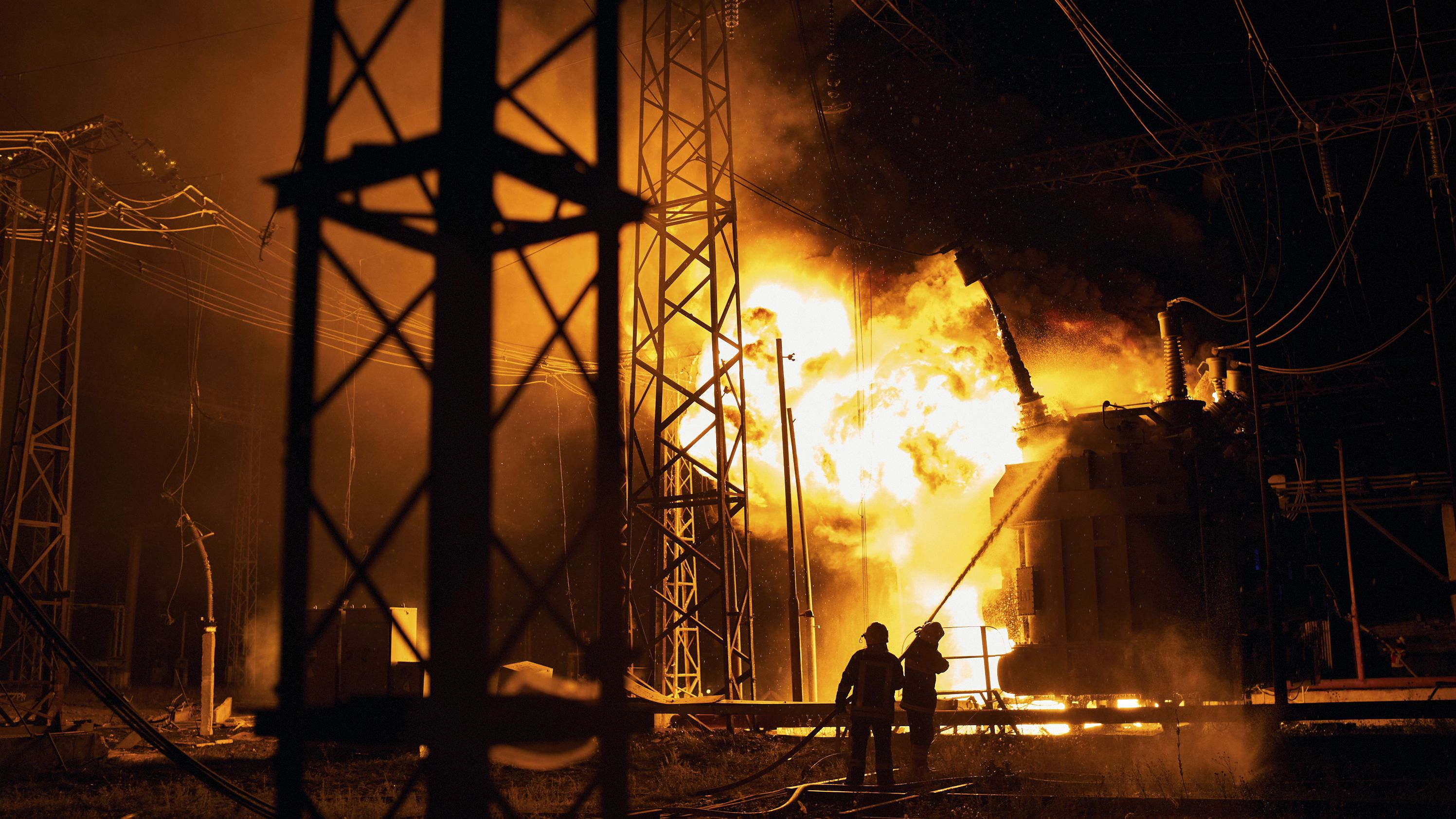 Ukrainian State Emergency Service firefighters put out a fire after a Russian rocket attack hit an electric power station in Kharkiv, Ukraine, on September 11.