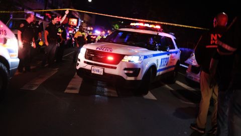 Police gather at the scene where officers were shot in the June 3, 2020, attack in New York City. 