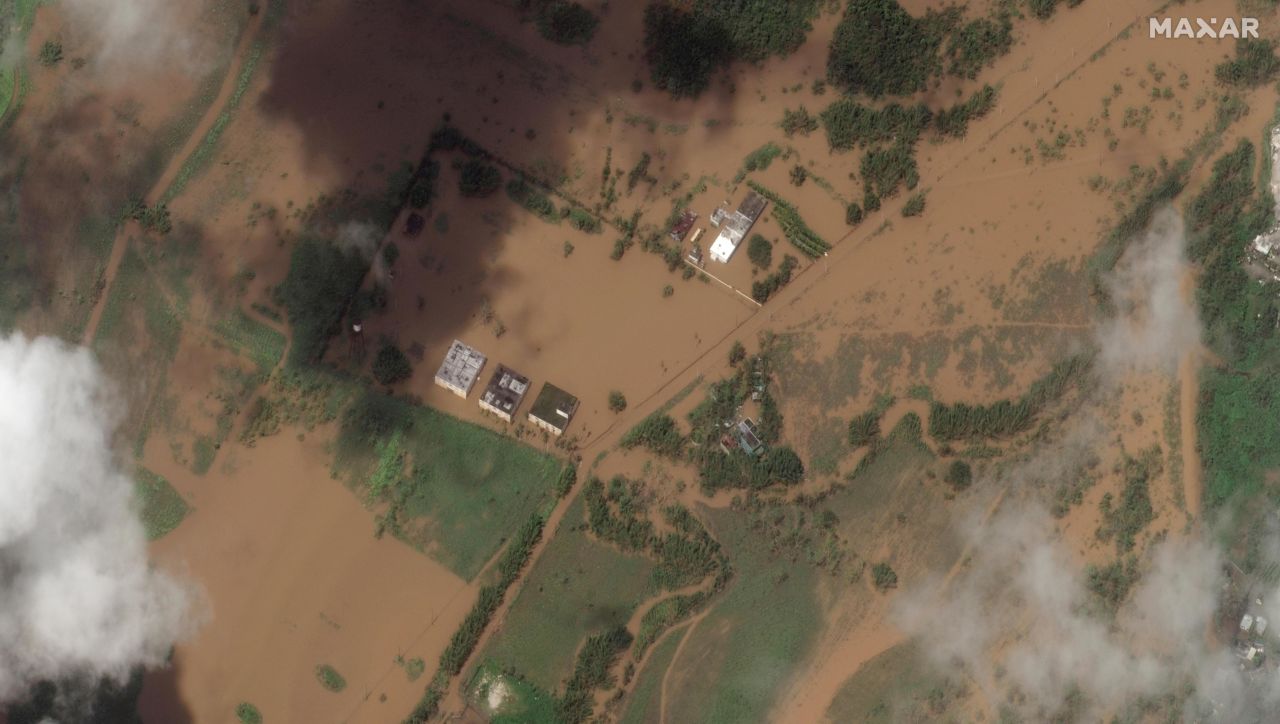 A satellite image shows flooded fields and buildings in Cerrillos, Puerto Rico, on Tuesday.