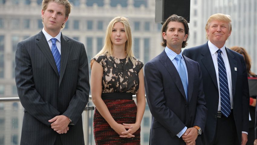 Real estate developer Donald Trump (R) and his children (L-R) Eric, Ivanka, and Donald Jr., attend a press conference at the Trump International Hotel and Tower in Chicago on September 24, 2008. Trump's 1,360-foot (414.5-meter), 92-story tower is expected to be finished in six months and will stand as the second-tallest building in Chicago, after the Sears Tower. AFP PHOTO/Amanda Rivkin (Photo credit should read Amanda Rivkin/AFP via Getty Images)