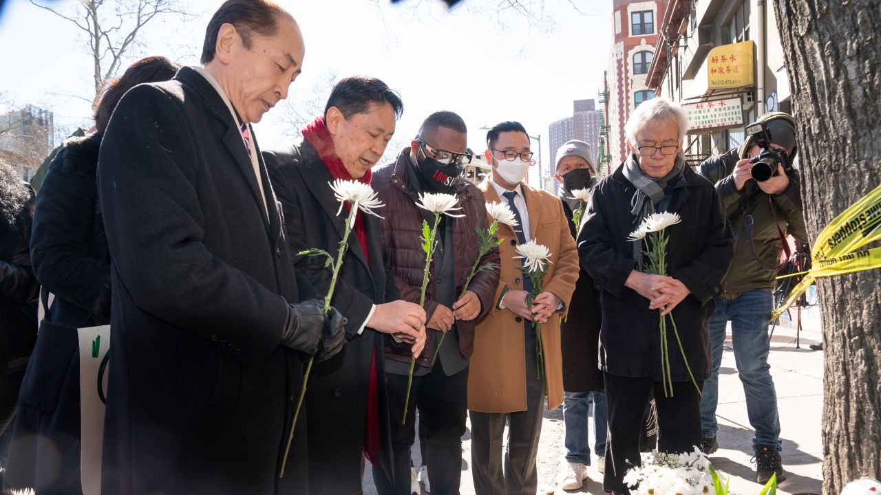 Asian American community leaders place flowers on a memorial for murder victim Christina Yuna Lee after an anti-Asian hate rally in Sarah D. Roosevelt Park Tuesday, Feb. 15, 2022 in Manhattan, New York. (Barry Williams/New York Daily News/Tribune News Service via Getty Images)