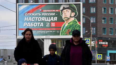 A billboard promoting contract army service with an image of a serviceman and the slogan reading "Serving Russia is a real job" sits in Saint Petersburg on September 20, 2022. (Photo by Olga MALTSEVA / AFP) (Photo by OLGA MALTSEVA/AFP via Getty Images)