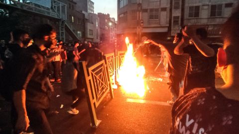 Dozens of people stage a demonstration to protest the death of Mahsa Amini in Tehran, Iran, on September 21.