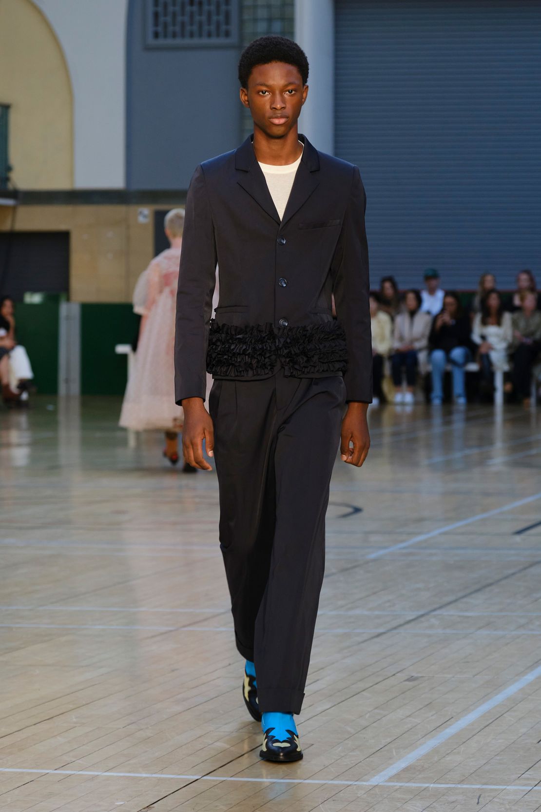 Molly Goddard trimmed suits and shirts with her signature ruffles.