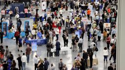 Job seekers visit booths during the Spring Job Fair at the Las Vegas Convention Center Friday, April 15, 2022.