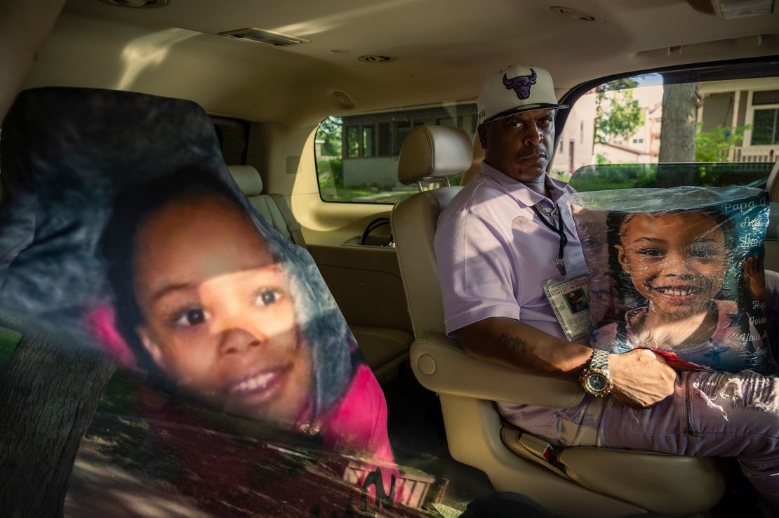 KG Wilson created a memorial for his granddaughter Aniya Allen in his SUV. The car seat cover of her face rests on the seat where she would ride with him. 