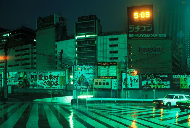 A 1979 image shows a crosswalk in Tokyo's Shinjuku district. Girard's once-futuristic images ooze vibrant greens, pinks and blues, colors saturated by his use of long exposure settings.