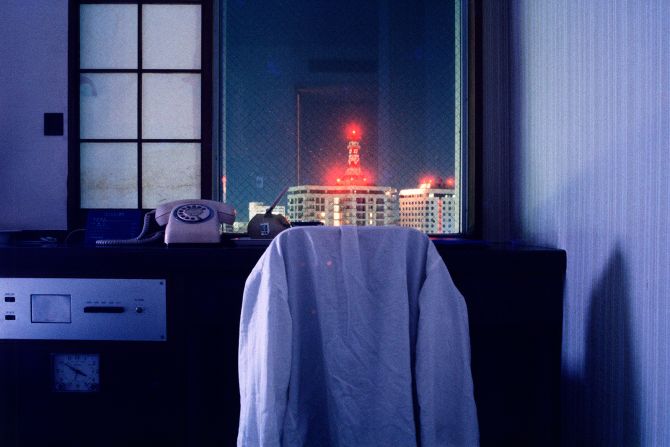 For all the vibrancy captured in Girard's photos, some of his most compelling images are void of human activity — back alleys, deserted streets and, as pictured here, empty hotel rooms. 