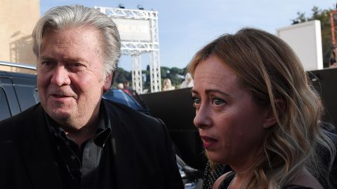 Former Trump White House chief strategist Steve Bannon (left) arrives with Giorgia Meloni to attend an Italy Brothers party convention in Rome on September 22, 2018.