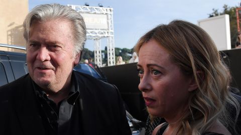 Former Trump White House chief strategist Steve Bannon (left) arrives with Giorgia Meloni to attend a congress of the Brothers of Italy party in Rome on September 22, 2018.