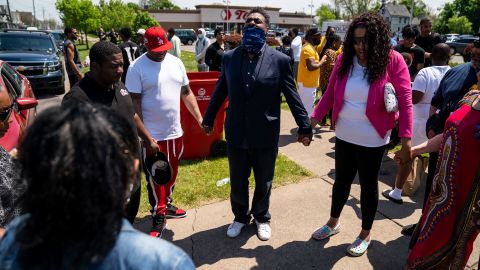 A prayer circle formed outside a Topps supermarket in Buffalo on Sunday, May 15, the day after the fatal shooting.