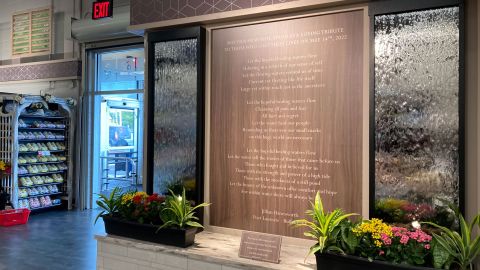 A memorial waterfall has been built inside the renovated Tops supermarket in Buffalo, which reopened in July, two months after the mass shooting.