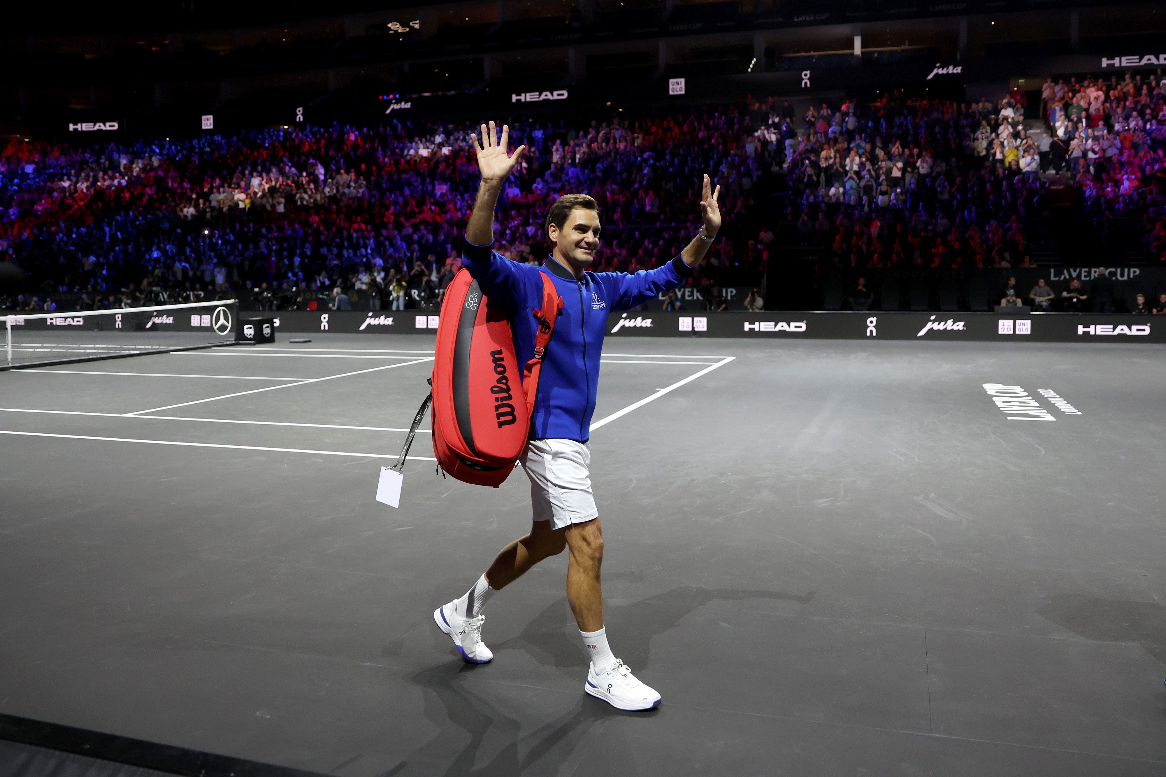 Tennis legend Roger Federer acknowledges a crowd in London after a Laver Cup practice session on Thursday, September 22.