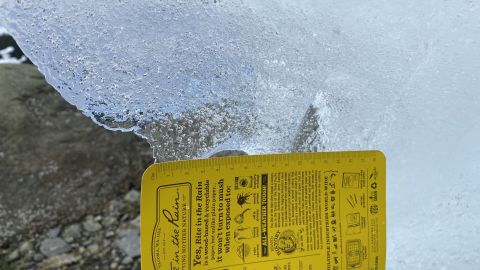 A close-up view of an iceberg shows a high density of air bubbles.