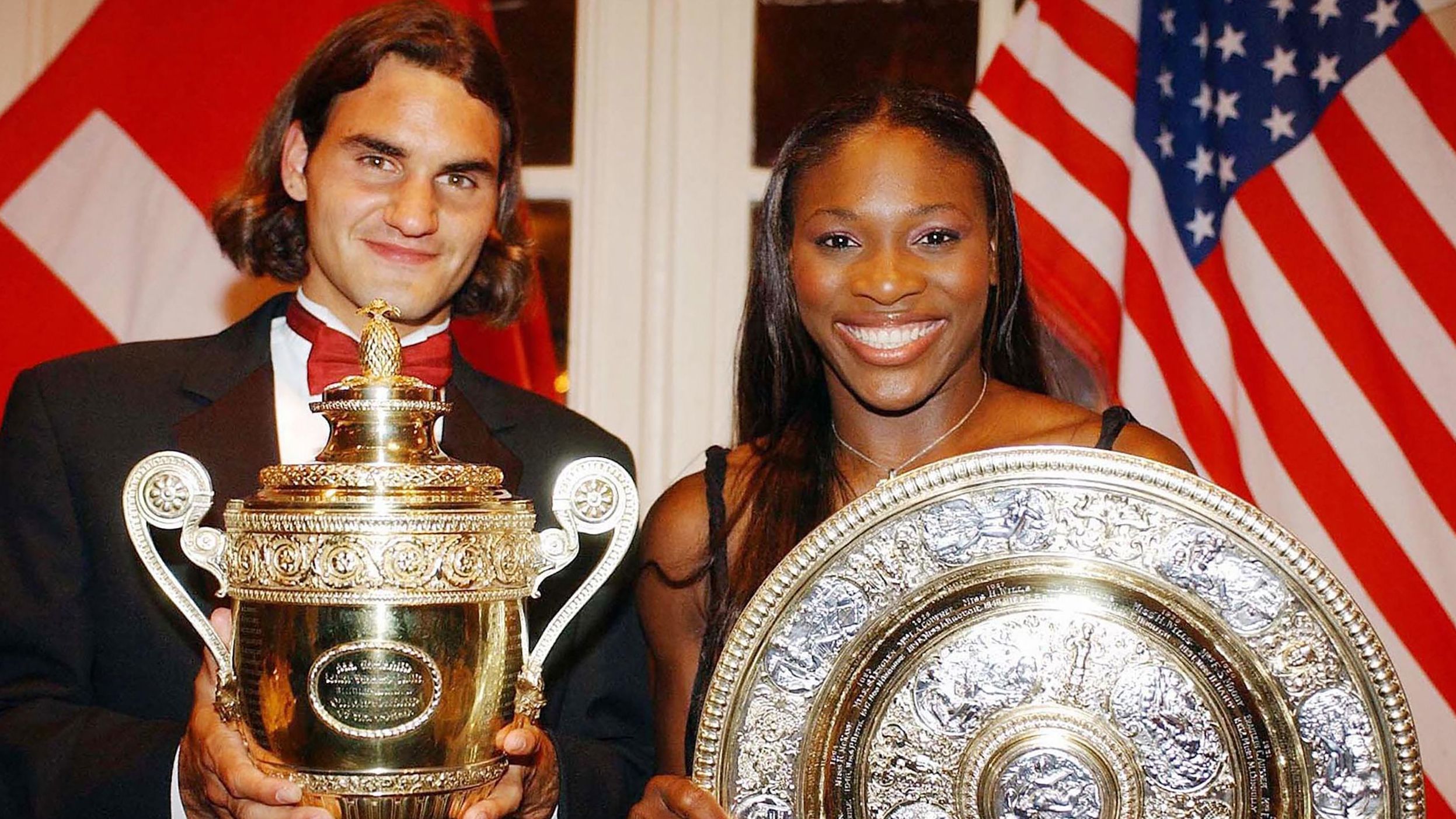 Federer and Serena Williams pose with their Wimbledon trophies in 2003.