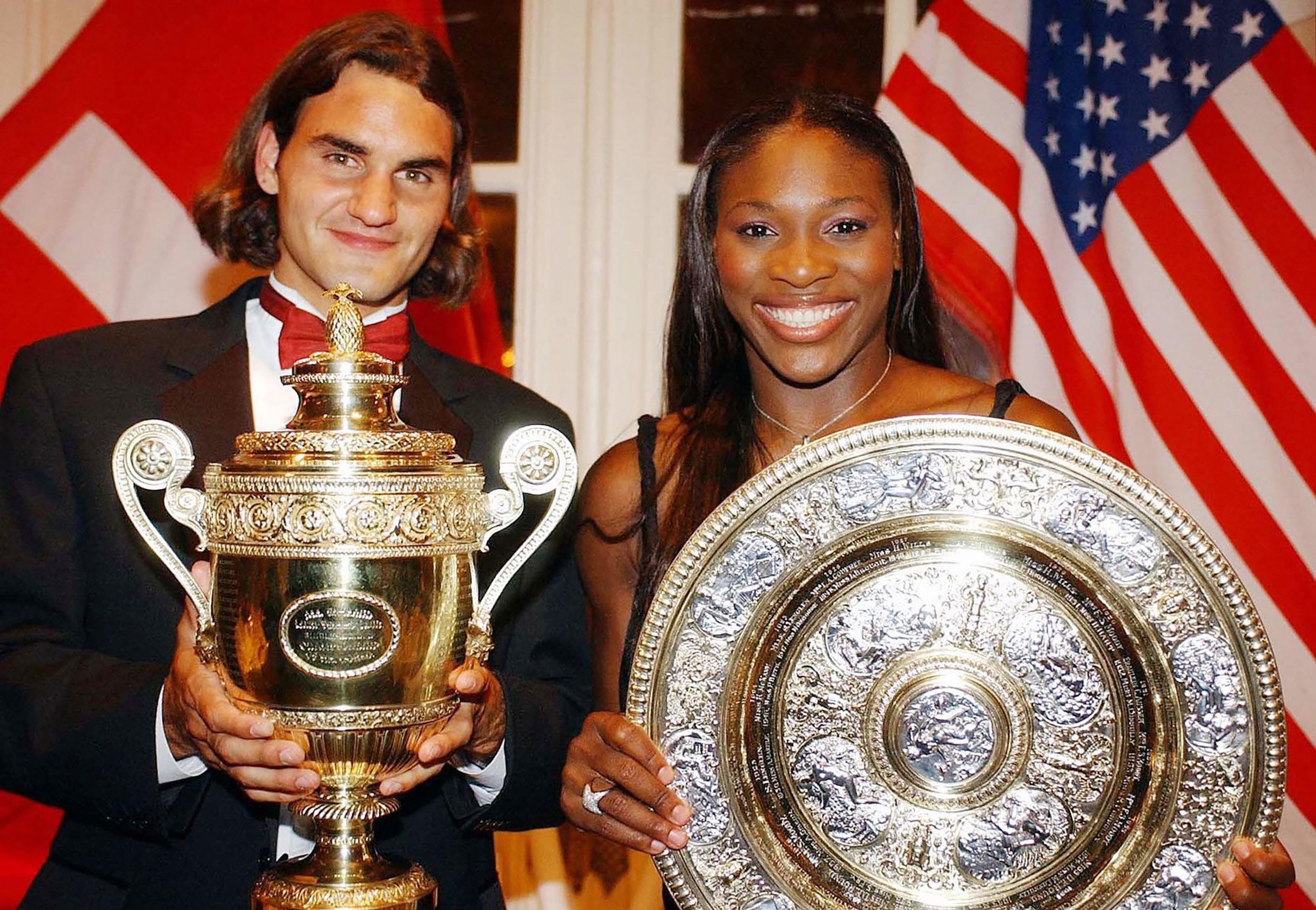 Federer and Serena Williams pose with their Wimbledon trophies in 2003.