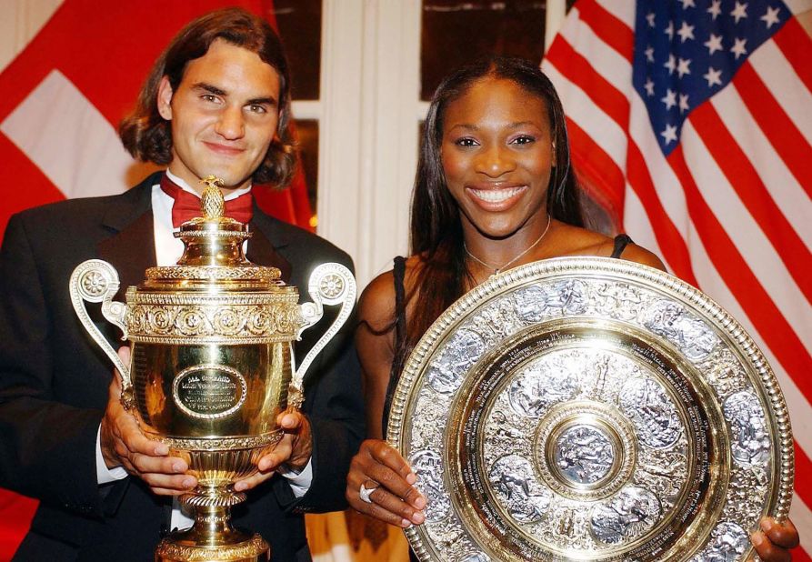 Federer and Serena Williams pose with their Wimbledon trophies in 2003.