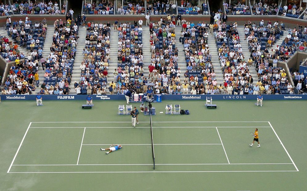 Federer celebrates after defeating Lleyton Hewitt to win his first US Open in 2004.