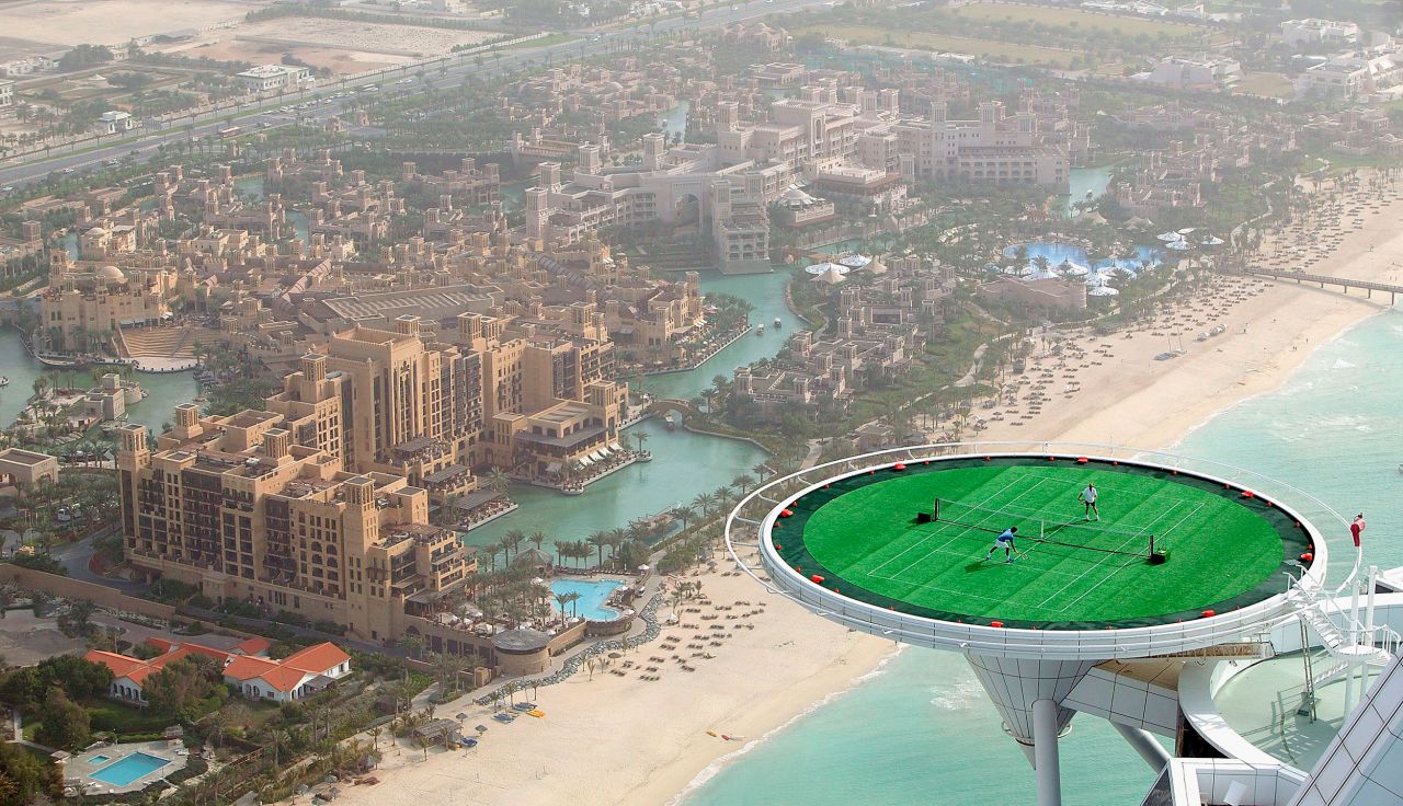 Federer and Andre Agassi hit balls on the helipad of the Burj Al Arab hotel in Dubai, United Arab Emirates, in 2005. It was ahead of a tournament in Dubai.