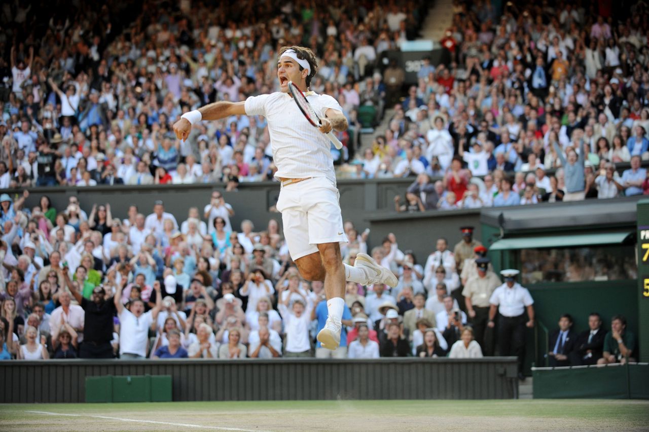 Federer celebrates after winning Wimbledon in 2009. It was his 15th major title, which at the time was the most ever for a men's tennis player.