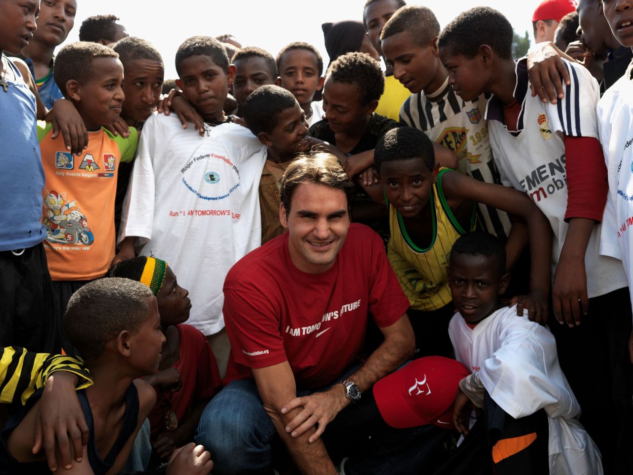 Federer poses with children in Kore Roba, Ethiopia, while visiting a school funded by his charity, the Roger Federer Foundation, in 2010.