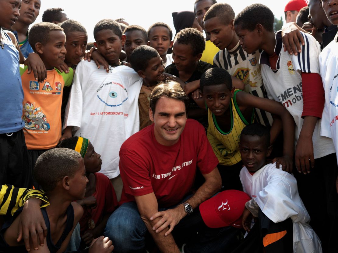 KORE ROBA, ETHIOPIA - FEBRUARY 12:  In this handout photo provided by the Roger Federer Foundation, World tennis number one Roger Federer poses with local school children during his visit to a school funded by his charity on February 12, 2010 in Kore Roba, Ethiopia. Federer was on a one-day visit to see the work carried out by the Roger Federer Foundation. Federer founded the foundation in 2003 which currently focuses on helping disadvantaged children in his mother's home country of South Africa.  (Photo by Roger Federer Foundation via Getty images)