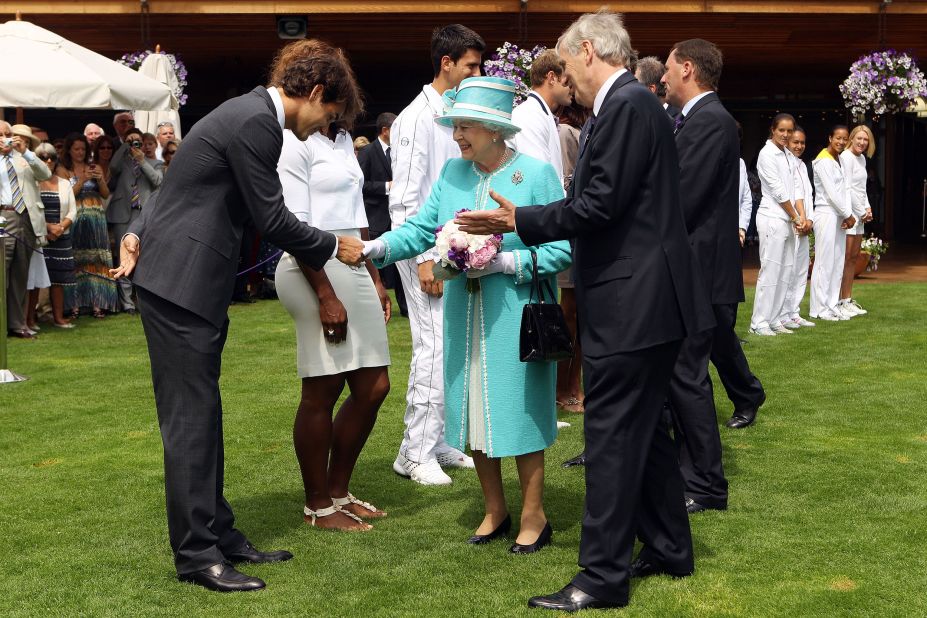 Federer greets Britain's Queen Elizabeth II while she attended Wimbledon in 2010.