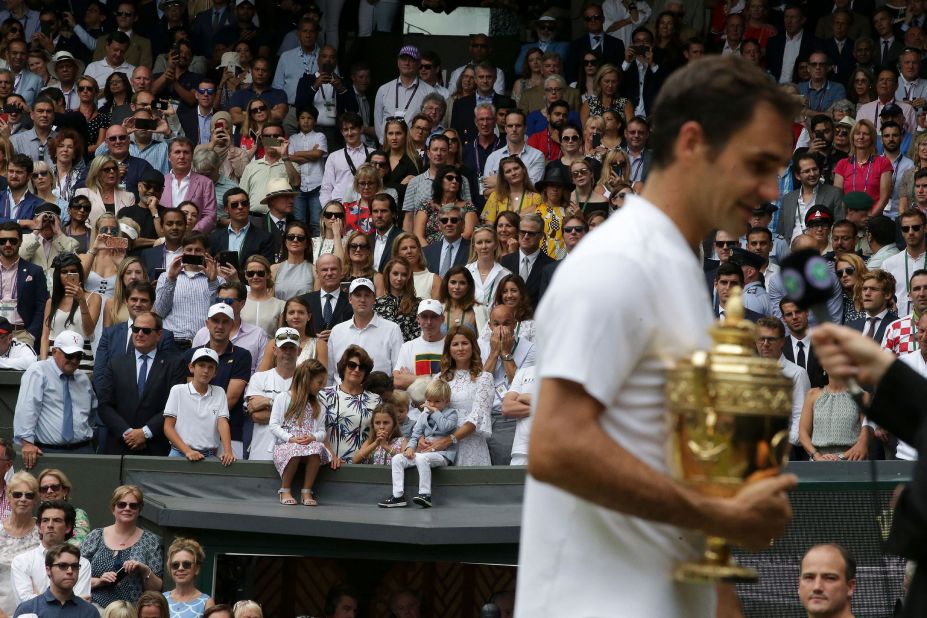 Federer is watched by his wife, Mirka, and their four children after winning Wimbledon in 2017. Federer has two sets of twins:  identical twin girls and fraternal twin boys.