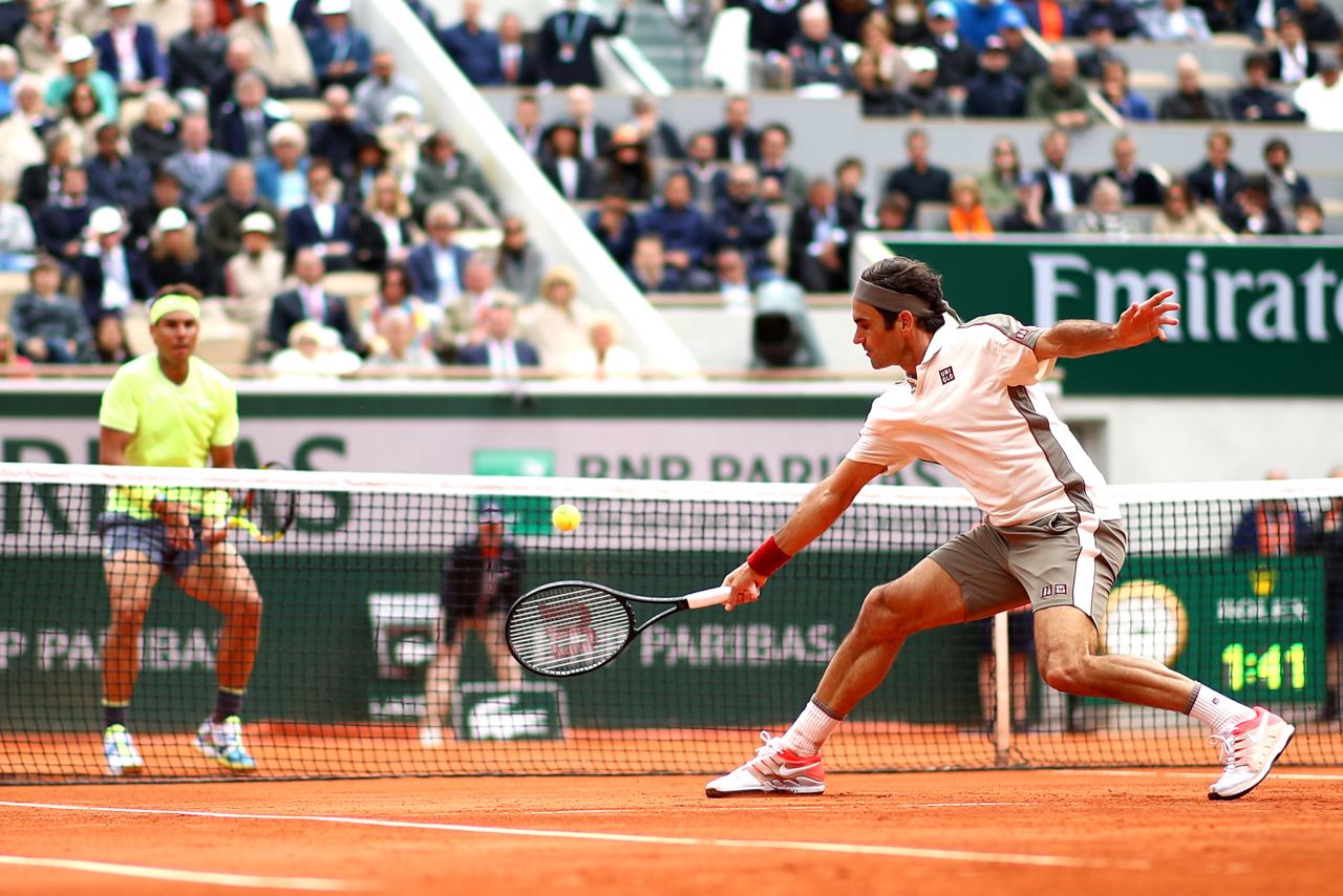Federer plays a backhand to Nadal during a French Open semifinal in 2019.