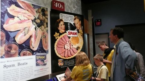 The family peruses the history of spam at the Spam Museum.