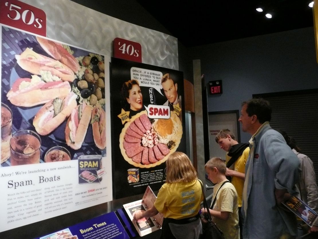 A family peruses the history of Spam at the Spam museum.