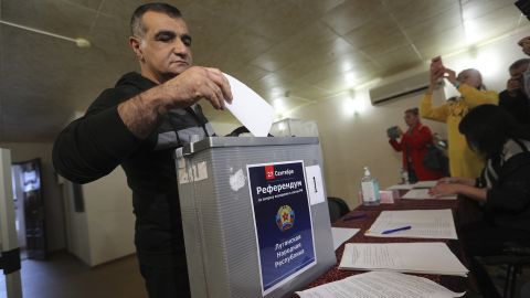 A man from Luhansk region, who lives in Russia, votes at temporary accommodation facility in Volgograd, Russia on Friday. 