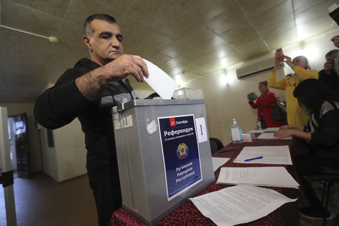 A man from Luhansk region, who lives in Russia, votes at temporary accommodation facility in Volgograd, Russia on Friday. 