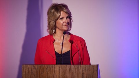 Arizona Republican Party chair Kelli Ward moderates a primary debate in Mesa on June 9, 2022.
