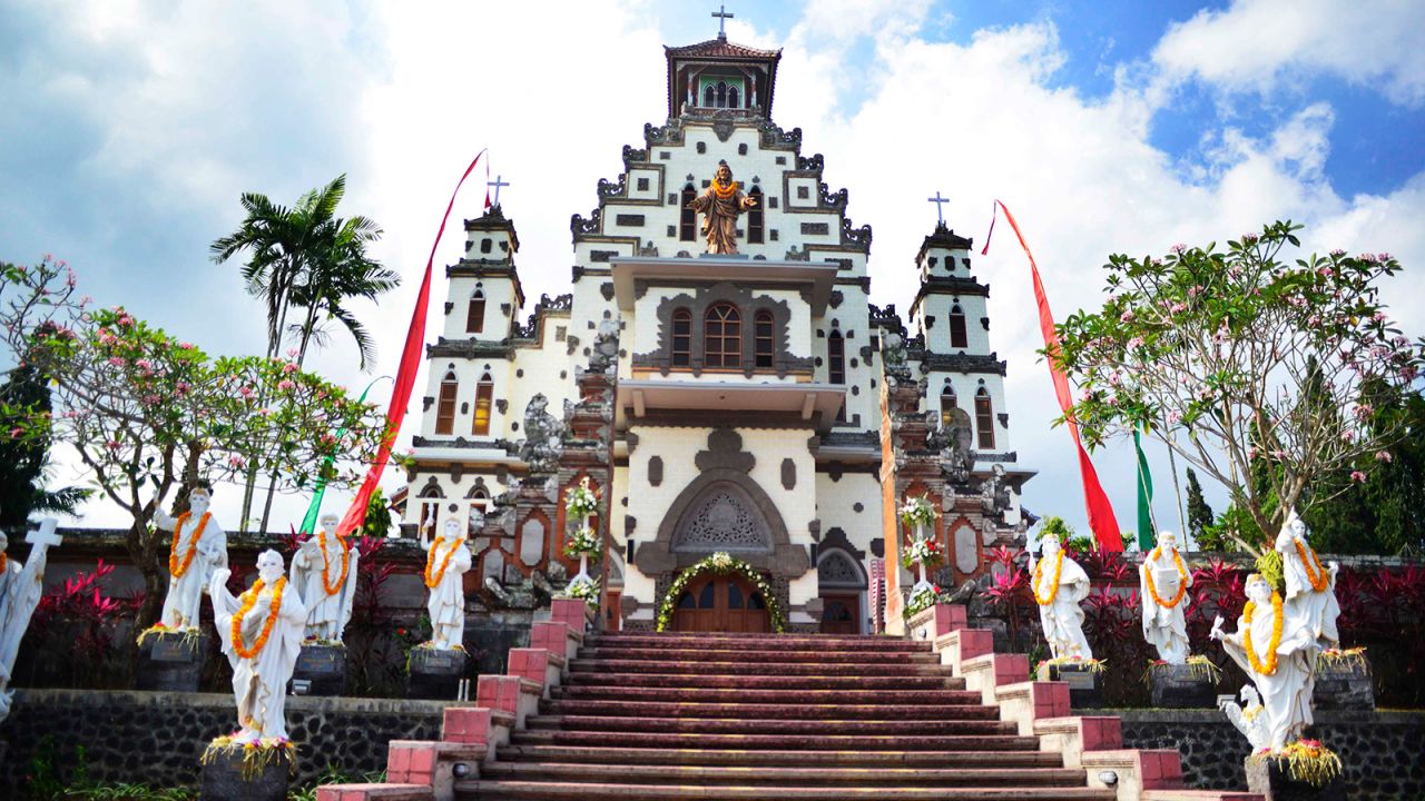 At Palasari the Sacred Heart of Jesus Church rises in an unexpectedly regal facade against the steaming jungle backdrop.