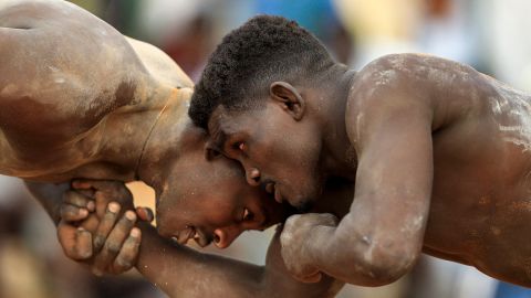 Competitors fight in a traditional Nuba wrestling match between the East Nile and Omdurman teams, at the Haj Youssef stadium in Sudan's Khartoum, on September 16.