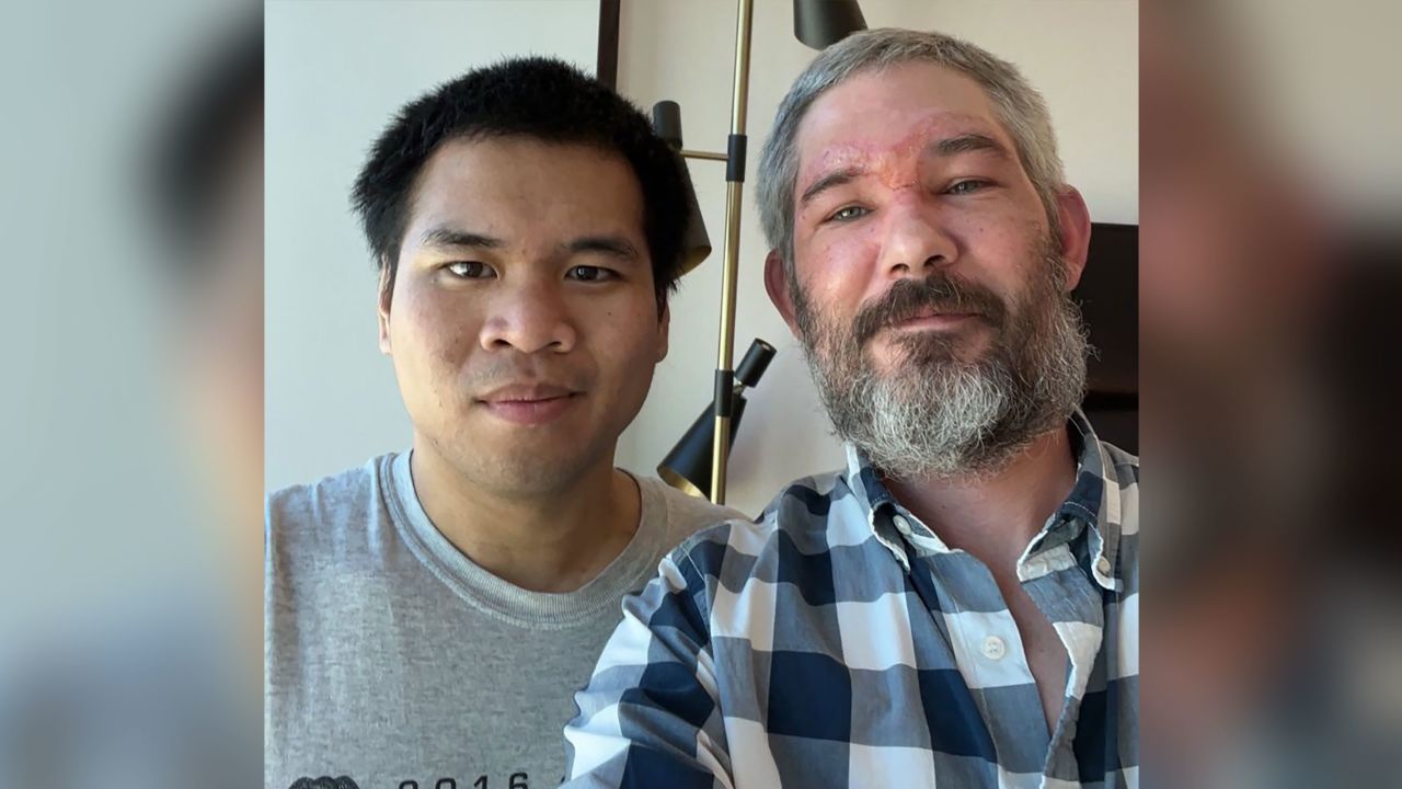 Americans Alexander John-Robert Drueke, right, and Andy Tai Ngoc Huynh, left, after arriving back in the US after being freed from Russian captivity.
