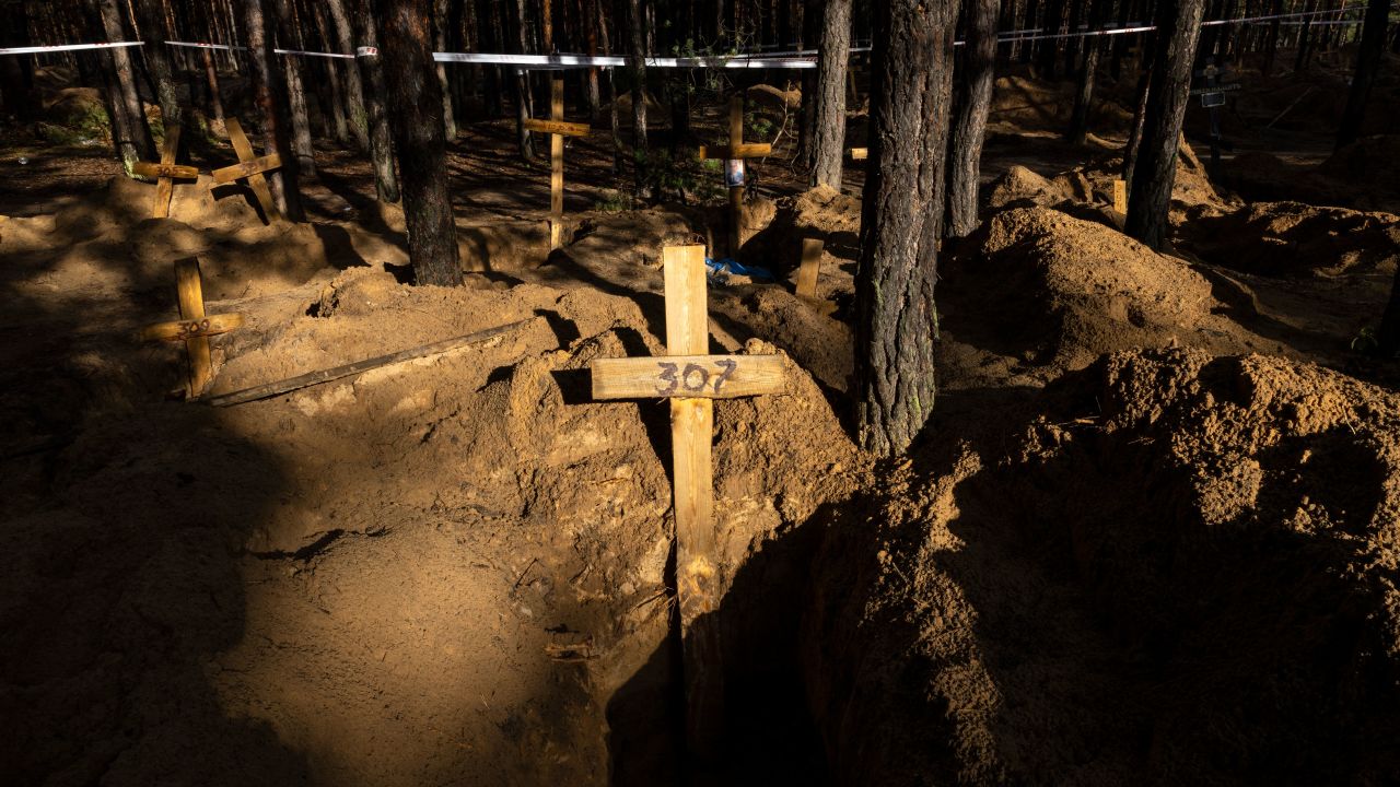 Unidentified makeshift graves at the Pishanske cemetery on September 23, 2022, in Izium, Ukraine.