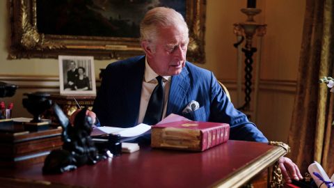 A new portrait of King Charles III shows him performing government duties in a red box at Buckingham Palace in London.